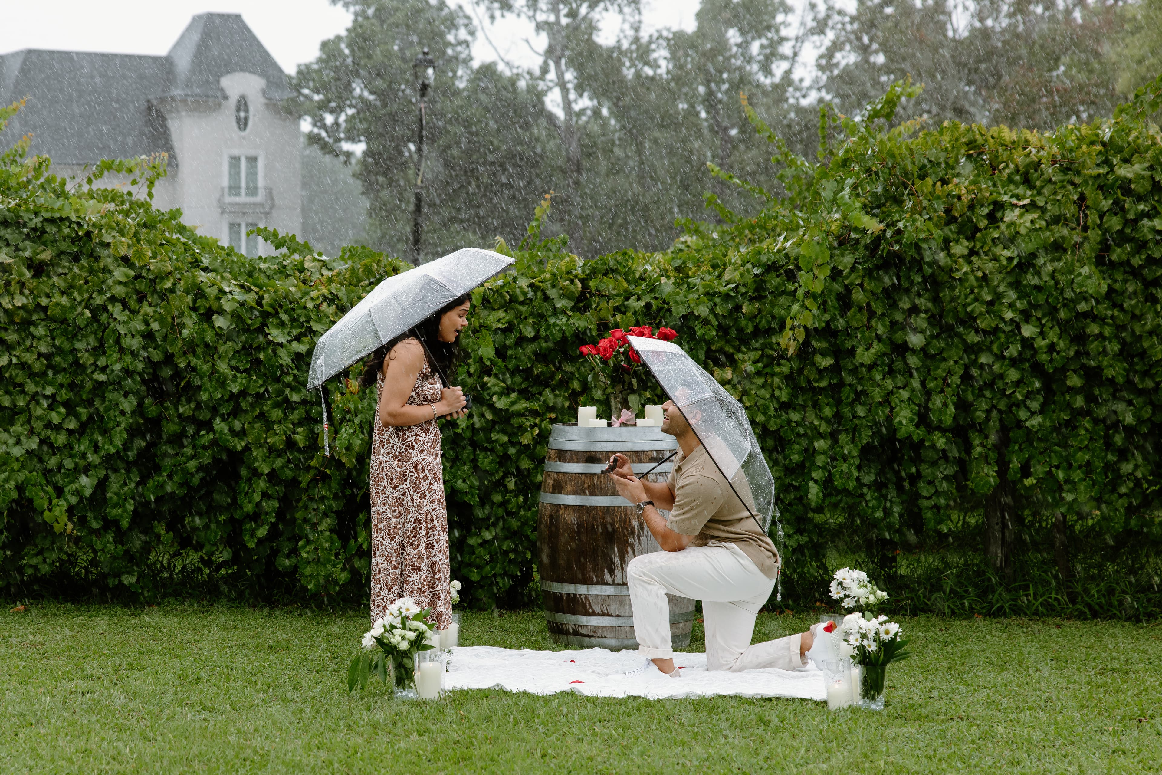 Akshay proposing to Beejal in the rain at Chateau Elan